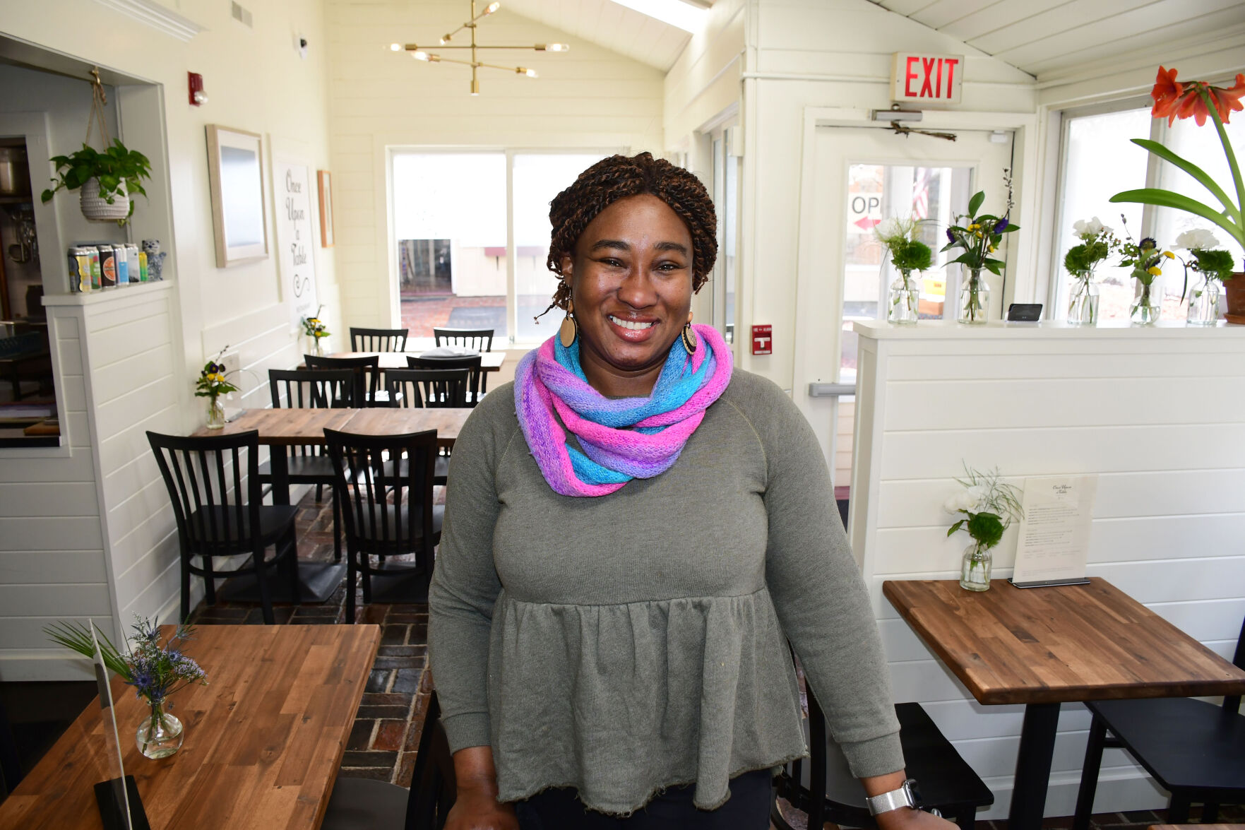 Avie Maloney stands in the restaurant